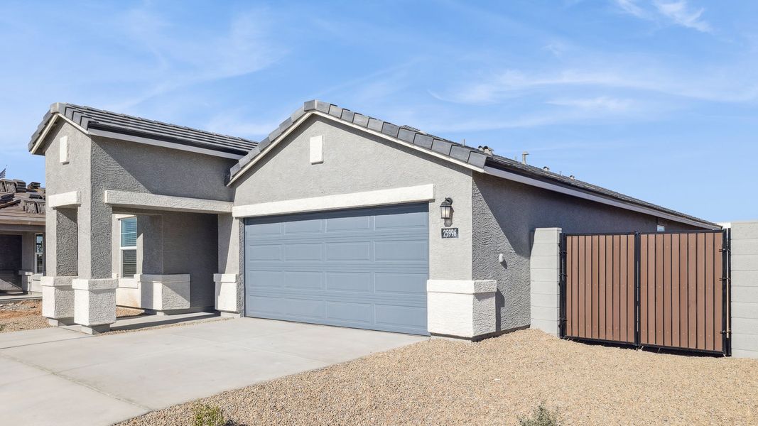 Representative exterior photo of a completed home built from the Gaven by D.R. Horton in Del Rio Ranch, Avondale, AZ (Image 22).