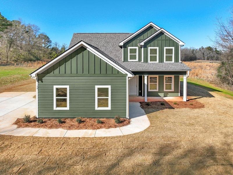 Front exterior of a new home in , Locust Grove, GA, highlighting curb appeal (Image 19).