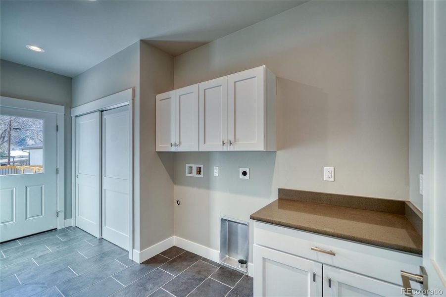Mudroom/laundry off the backyard