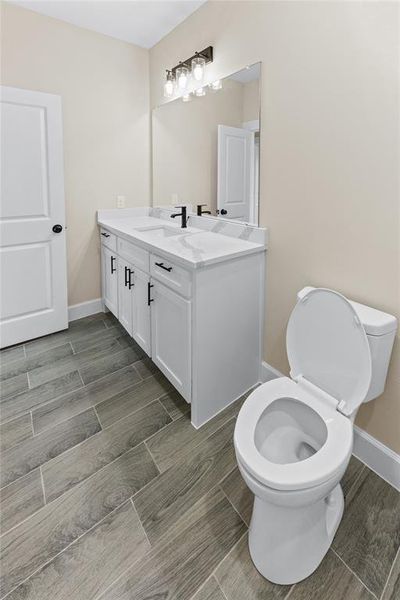 Bathroom with vanity and toilet