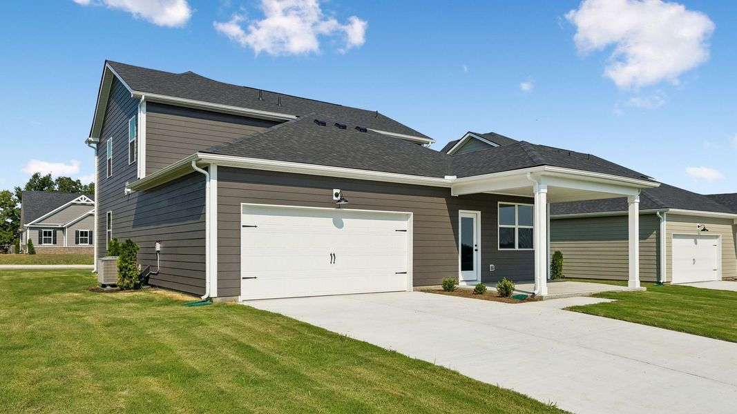 Front exterior of a new home in Reserve at Hickory Ridge, Columbia, TN, highlighting curb appeal (Image 2). Front exterior of a new home in Reserve at Hickory Ridge, Columbia, TN, highlighting curb appeal (Image 2).