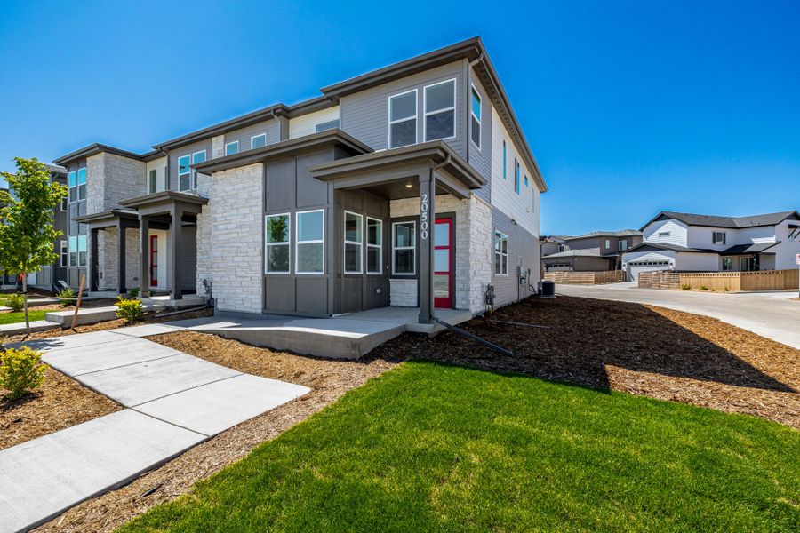 Front exterior of a new home in Painted Prairie, Aurora, CO, highlighting curb appeal (Image 25). Front exterior of a new home in Painted Prairie, Aurora, CO, highlighting curb appeal (Image 25).