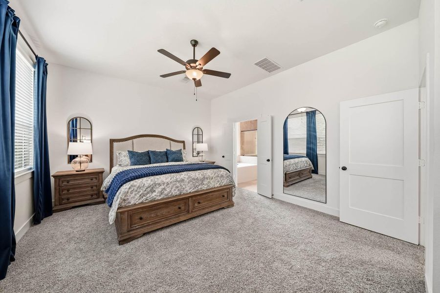 Generous proportions allow for a beautifully appointed sitting area, creating an intimate retreat for reading, relaxing, or enjoying a quiet moment in the privacy of the primary suite.