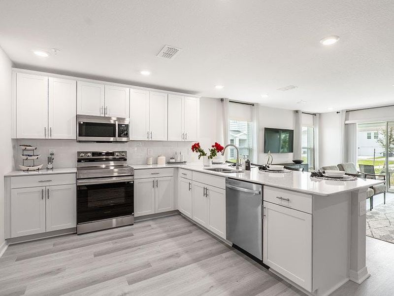 Choose from homes with warm wood or classic white finishes - Daisy townhome by Highland Homes