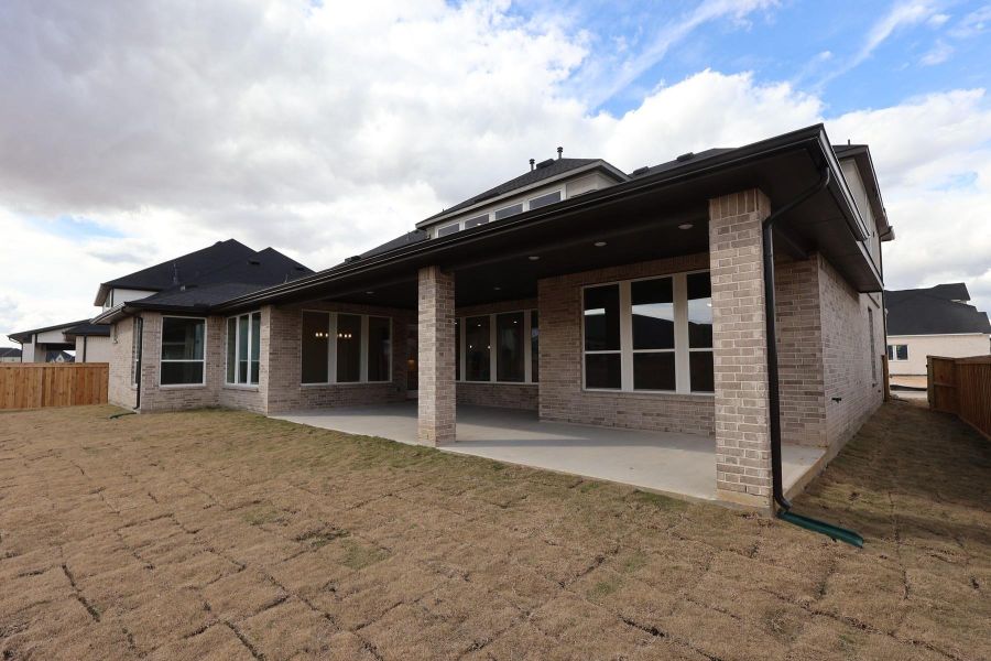 Exterior details and patio area of a home in Dunham Pointe, Cypress (Image 23).