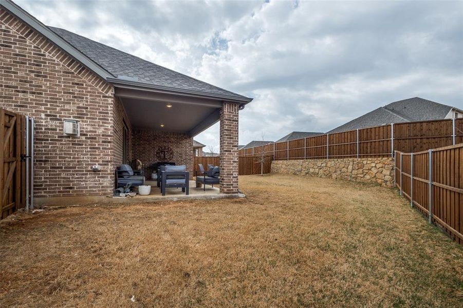 Exterior details and patio area of a home in Ashford Park - Texana Series, Corinth (Image 21).