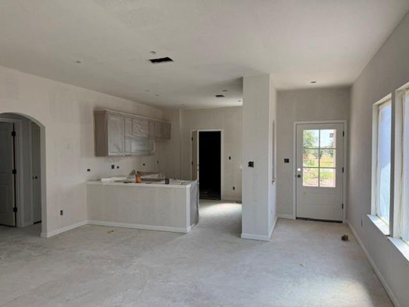 An open floorplan offers a seamless flow between living areas, creating an inviting atmosphere.