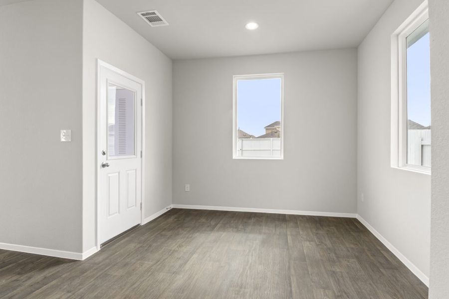 Image of dining room with a white back door and a window Image of dining room with a white back door and a window