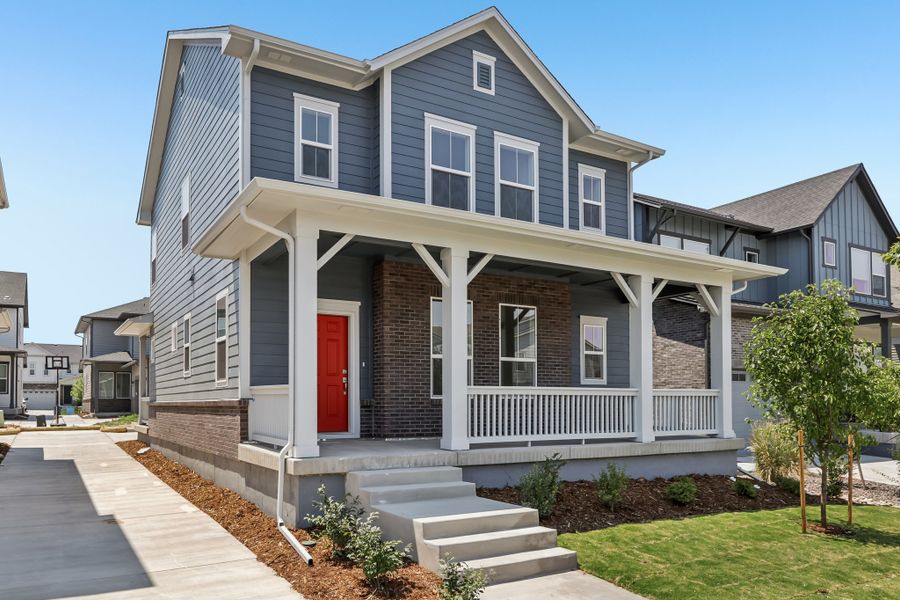 Front exterior of a new home in Painted Prairie Cottage, Aurora, CO, highlighting curb appeal (Image 2). Front exterior of a new home in Painted Prairie Cottage, Aurora, CO, highlighting curb appeal (Image 2).