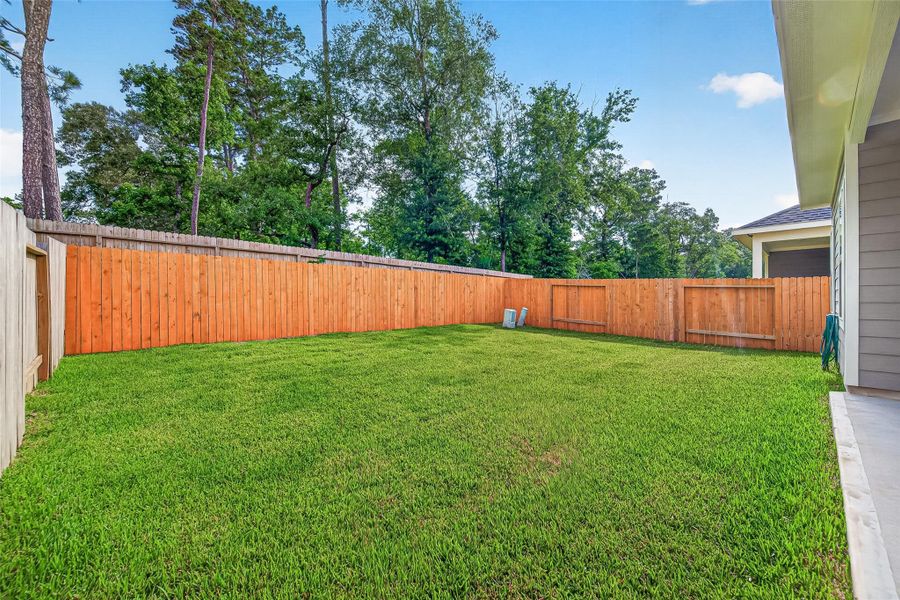 Exterior details and patio area of a home in Mill Creek Trails, Magnolia (Image 31).