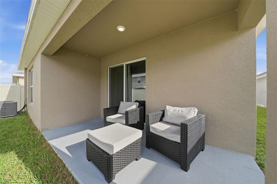 Exterior details and patio area of a home in Harvest Ridge, Zephyrhills (Image 4).