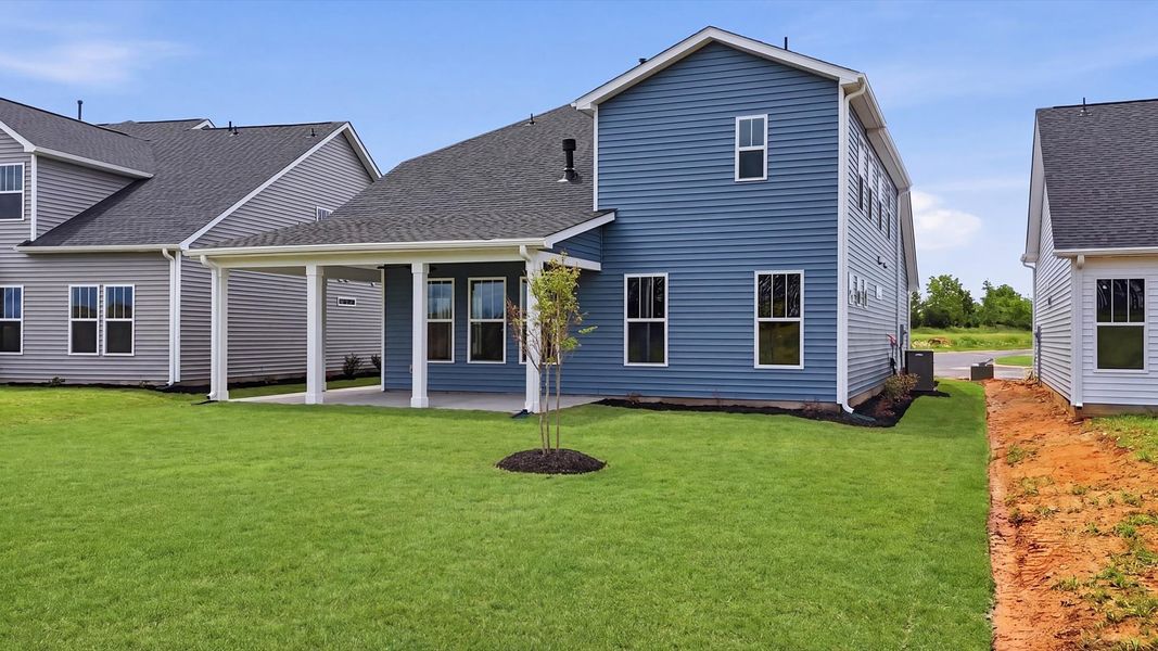 Accomplished exterior with a spacious rear porch that blends comfort and style