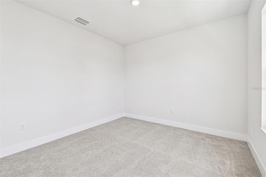 Spacious, unfurnished interior of a new home in Emerald Landing at Waterside at Lakewood Ranch – Cottage Series, Sarasota (Image 20).