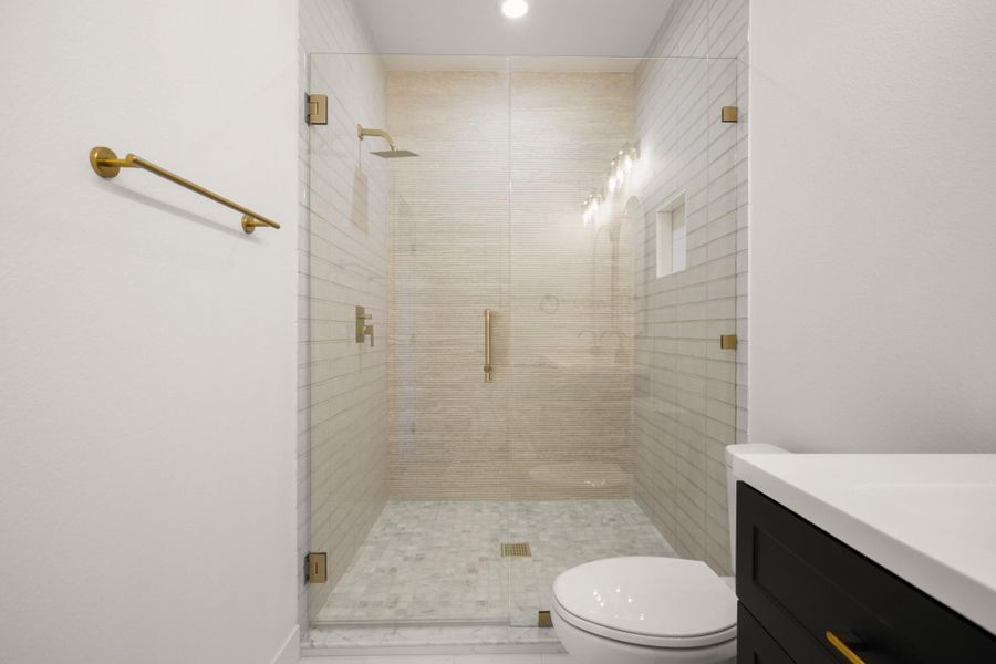 Bathroom featuring vanity and a shower stall