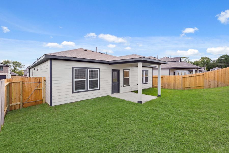 Exterior details and patio area of a home in Lexington Heights, Willis (Image 4). Exterior details and patio area of a home in Lexington Heights, Willis (Image 4).