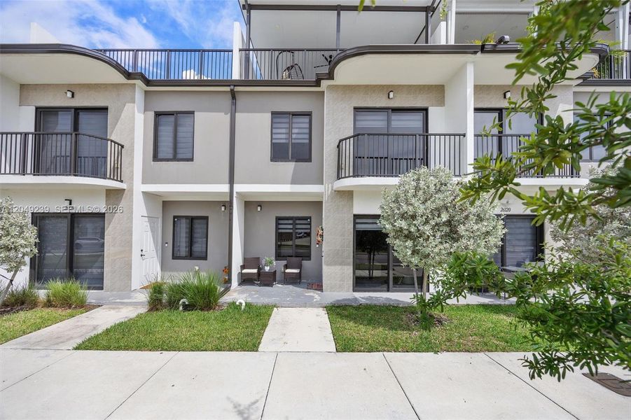 Front exterior of a new home in , Homestead, FL, highlighting curb appeal (Image 1). Front exterior of a new home in , Homestead, FL, highlighting curb appeal (Image 1).