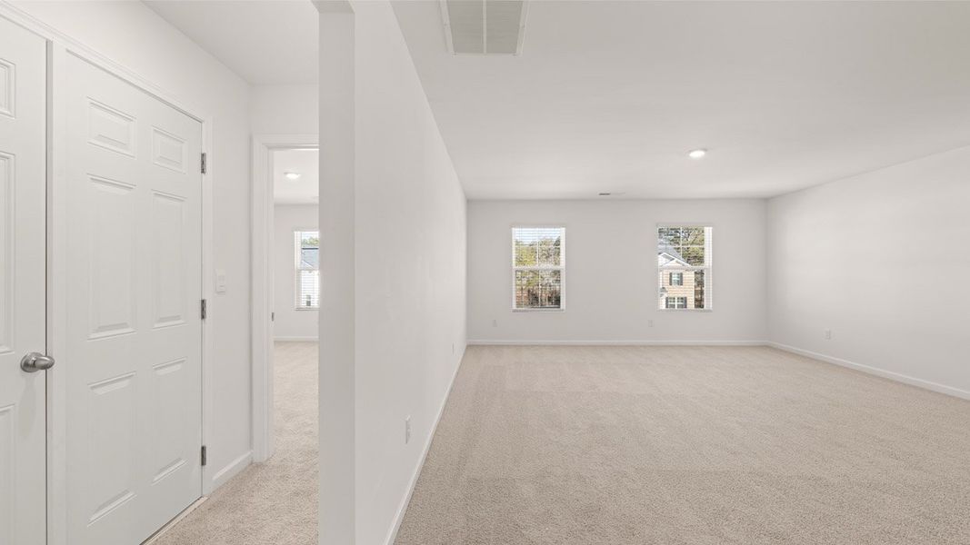 Representative unfurnished interior of a home built from the Mansfield by D.R. Horton in Brooks Station, Dacula (Image 25).