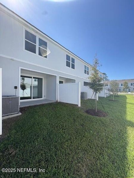 Exterior details and patio area of a home in Cordera Townhomes Express, St. Augustine (Image 25).