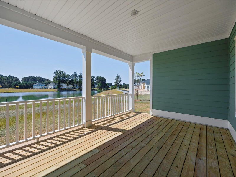 Exterior details and patio area of a home in The Coves at Lakes of Cane Bay II, Summerville (Image 26).