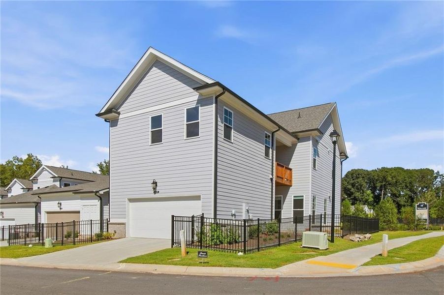 Front exterior of a new home in Waterside Single Family, Peachtree Corners, GA, highlighting curb appeal (Image 14).
