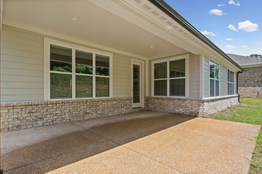 Covered patio with exposed aggregate concrete flooring Covered patio with exposed aggregate concrete flooring
