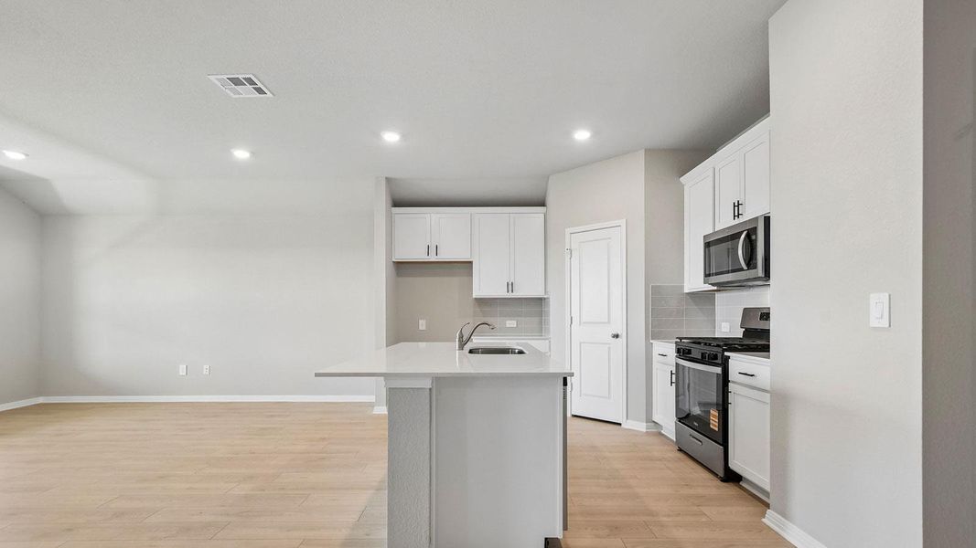 Furnished interior view inside a new home in Carillon, Manor (Image 9).