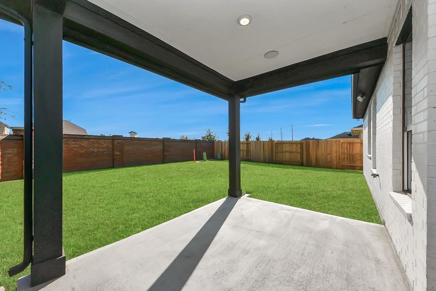 Exterior details and patio area of a home in Sunterra: Premier Collection, Katy (Image 21).