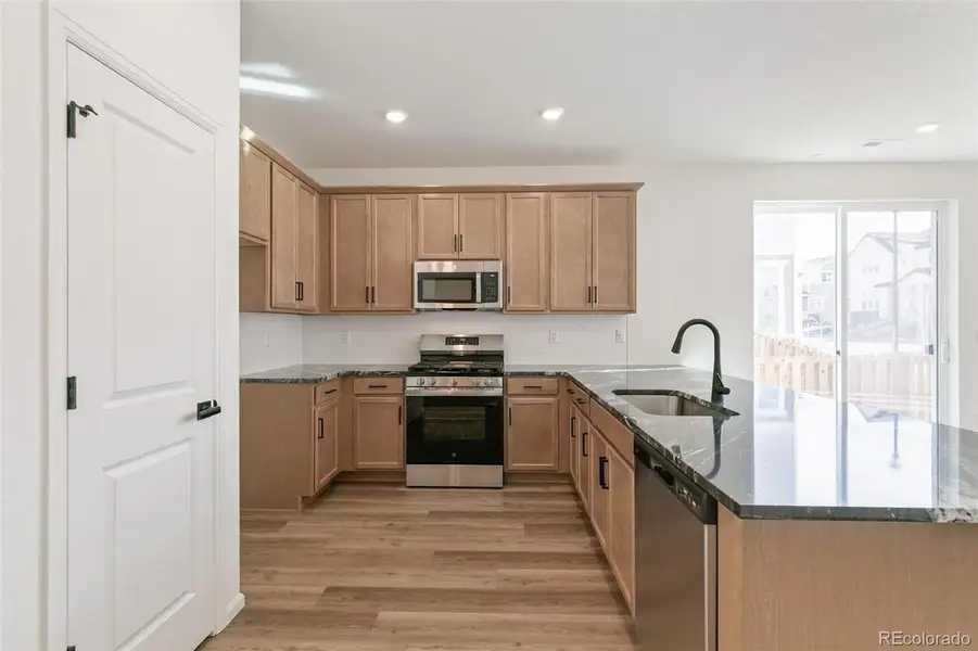 Furnished interior view inside a new home in Turnberry Villas, Commerce City (Image 7).