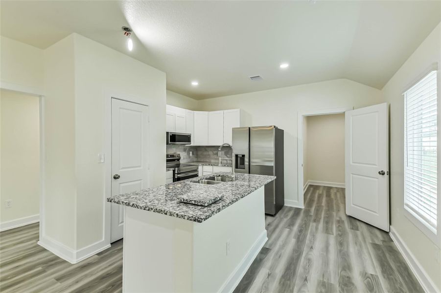 Furnished interior view inside a new home in , Conroe (Image 3).