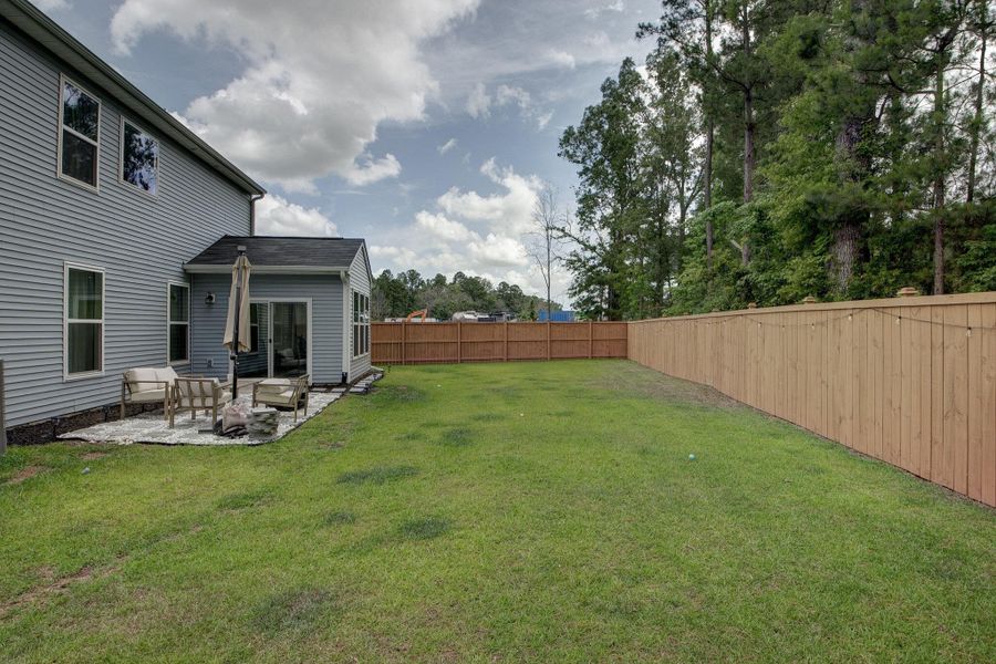 Exterior details and patio area of a home in Oakley Pointe, Moncks Corner (Image 37). Exterior details and patio area of a home in Oakley Pointe, Moncks Corner (Image 37).
