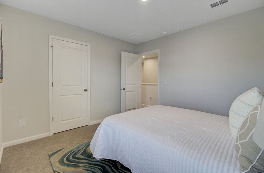 Furnished interior view inside a new home in Sanctuary Cove at Cane Bay, Summerville (Image 40).