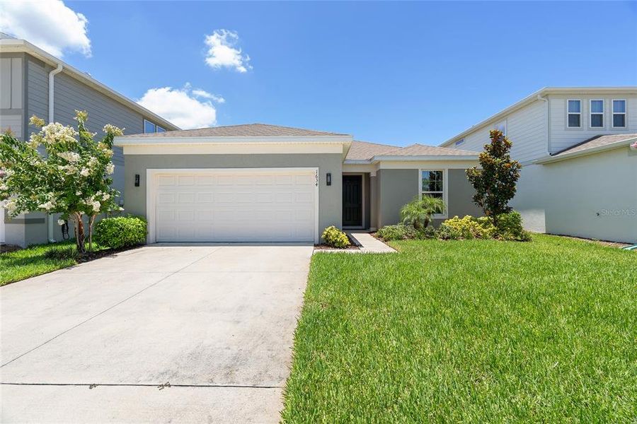 Front exterior of a new home in , St. Cloud, FL, highlighting curb appeal (Image 2).