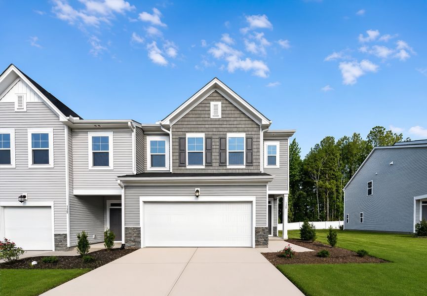 Front exterior of a new home in Parker Ridge Townes, Rolesville, NC, highlighting curb appeal (Image 1). Front exterior of a new home in Parker Ridge Townes, Rolesville, NC, highlighting curb appeal (Image 1).