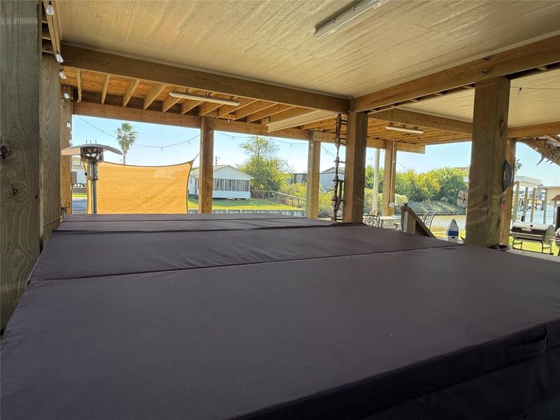 Swim Spa and hot tub placed in protected area under house and with convenient shower and half bath.