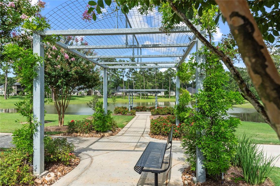 Scenic walking paths, lush landscaping, and peaceful pond offer the perfect setting to relax and connect with neighbors in this thoughtfully designed community.