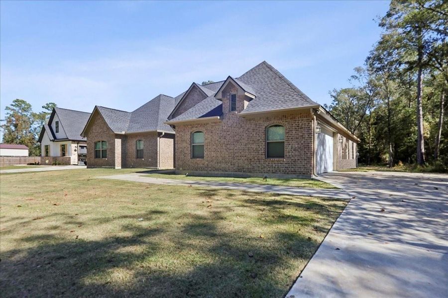 Front exterior of a new home in , Orange, TX, highlighting curb appeal (Image 2). Front exterior of a new home in , Orange, TX, highlighting curb appeal (Image 2).