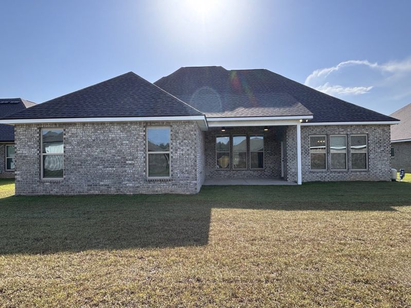 Exterior details and patio area of a home in Bird Song at Hammock Bay, Freeport (Image 23).