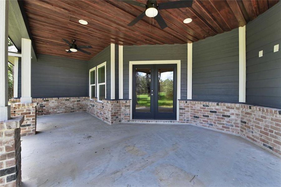 This covered back porch makes me smile! That tongue and groove ceiling is stunning!