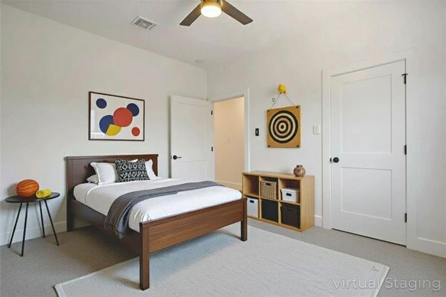 Bedroom with light carpet and ceiling fan Bedroom with light carpet and ceiling fan