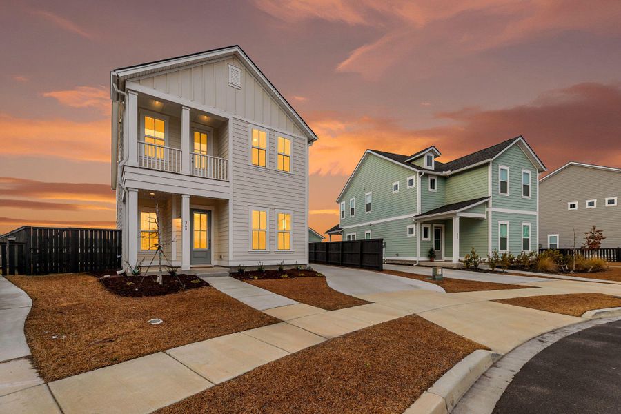 Front exterior of a new home in Carnes Crossroads, Summerville, SC, highlighting curb appeal (Image 20).