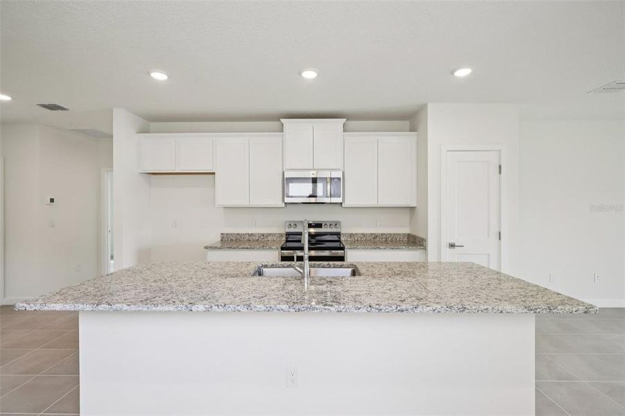 Furnished interior view inside a new home in Grasslands West, Lakeland (Image 8).