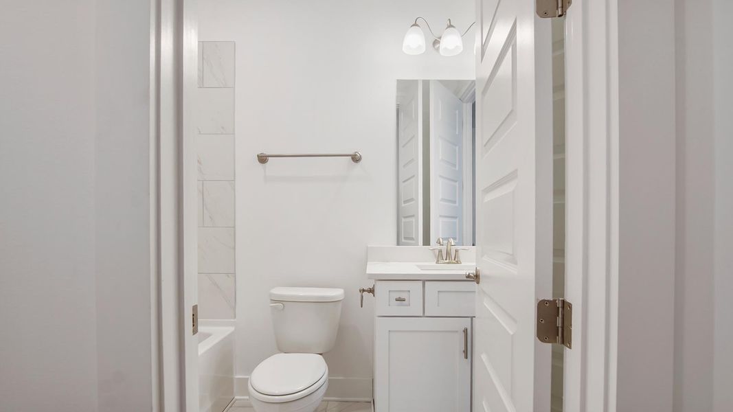Representative furnished interior of a home built from the Lily by D.R. Horton in Breakfast Point East Phase II, Panama City Beach (Image 12).