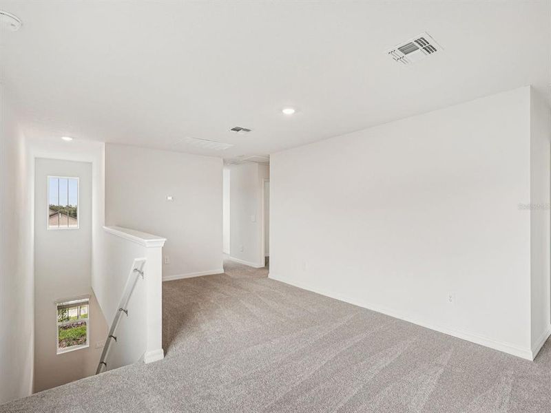 Spacious, unfurnished interior of a new home in Coasterra - Premier Series, Palmetto (Image 18).