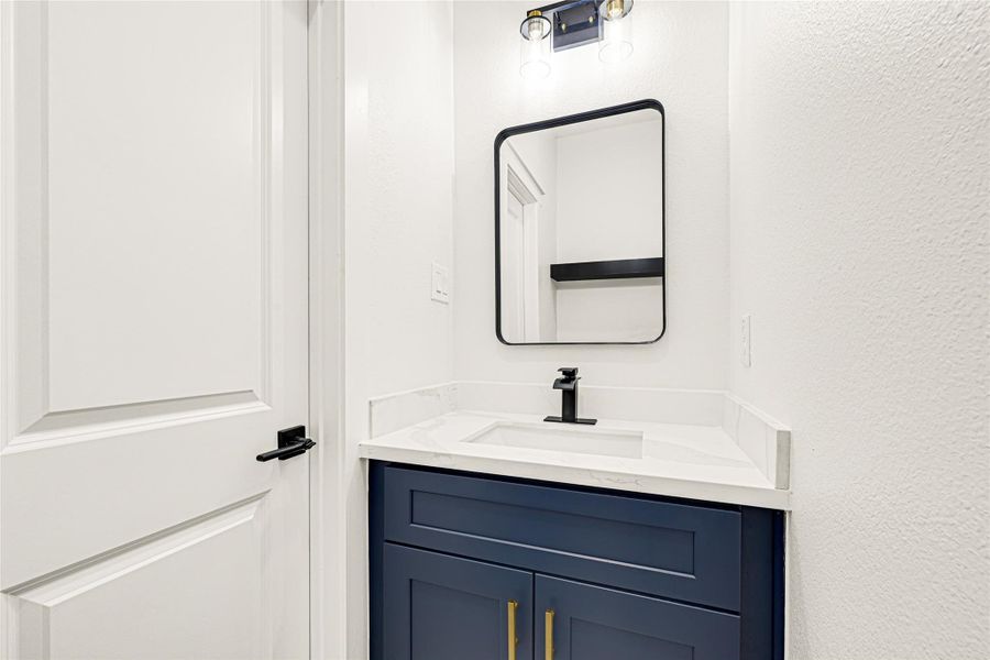 Half bath is conveniently located near foyer