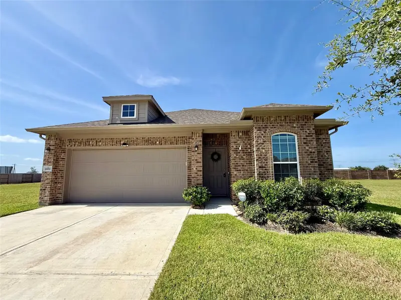 Front exterior of a new home in , Angleton, TX, highlighting curb appeal (Image 25).