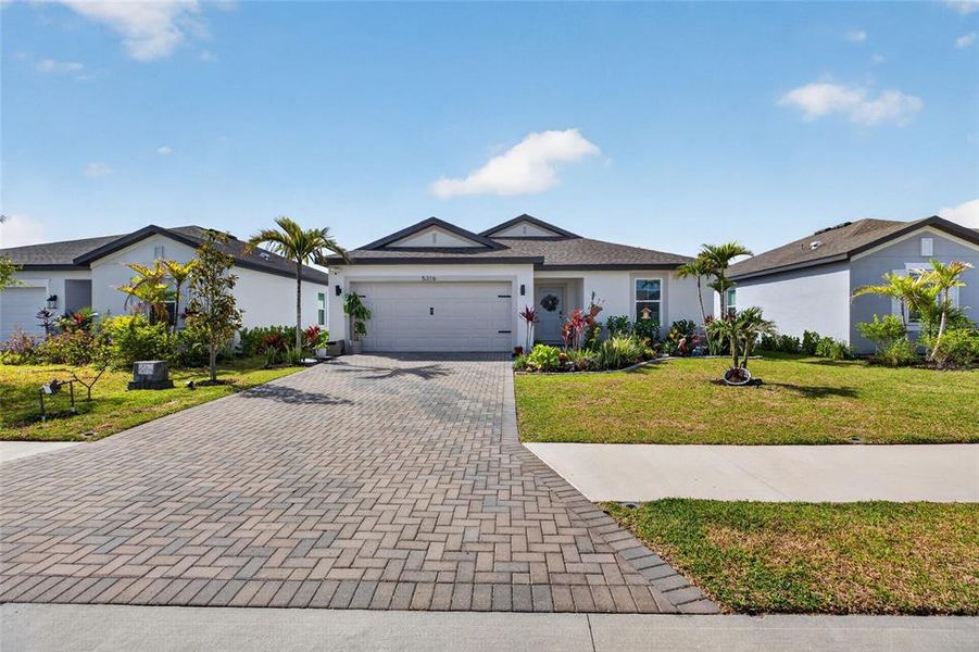 Front exterior of a new home in , Palmetto, FL, highlighting curb appeal (Image 2). Front exterior of a new home in , Palmetto, FL, highlighting curb appeal (Image 2).