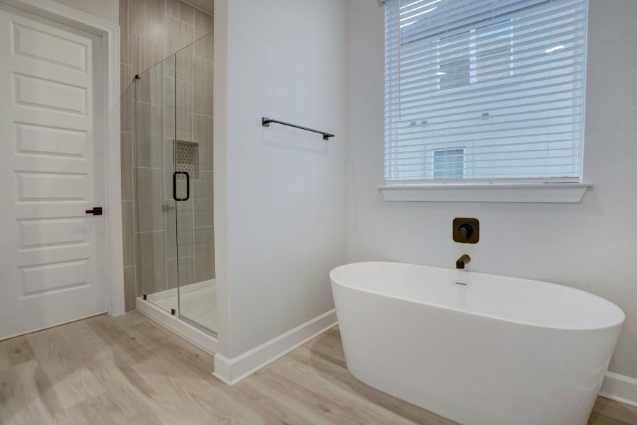 Furnished interior view inside a new home in ShadowGlen, Manor (Image 4).