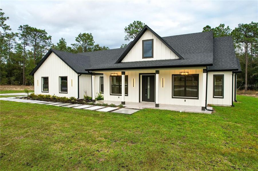 Front exterior of a new home in , Dunnellon, FL, highlighting curb appeal (Image 26).