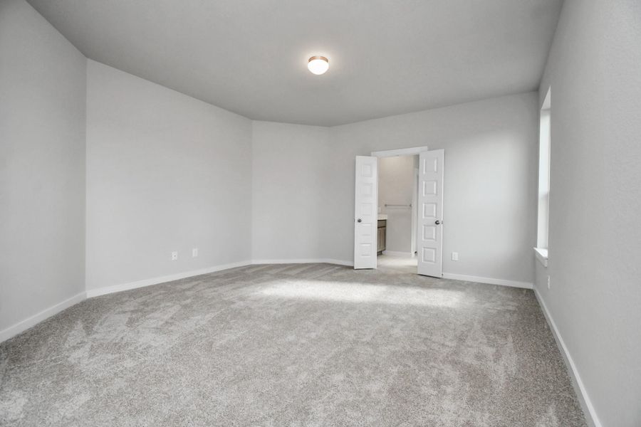 Come and unwind after a long day in this magnificent primary suite! This spacious room features plush carpet, warm paint, high ceilings and large windows with privacy blinds. Come and unwind after a long day in this magnificent primary suite! This spacious room features plush carpet, warm paint, high ceilings and large windows with privacy blinds.