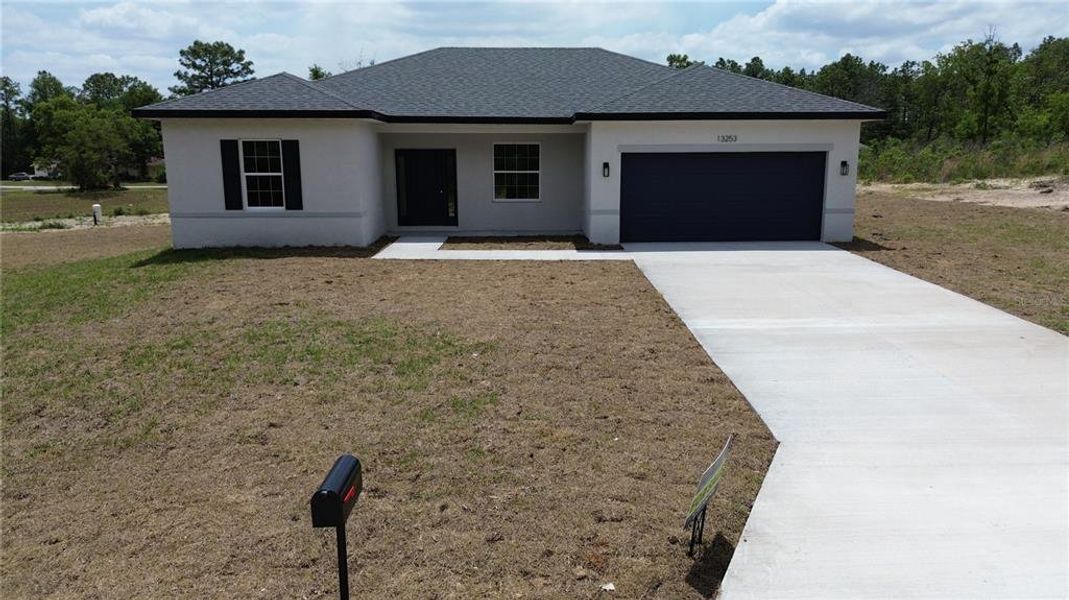 Front exterior of a new home in , Ocala, FL, highlighting curb appeal (Image 10).